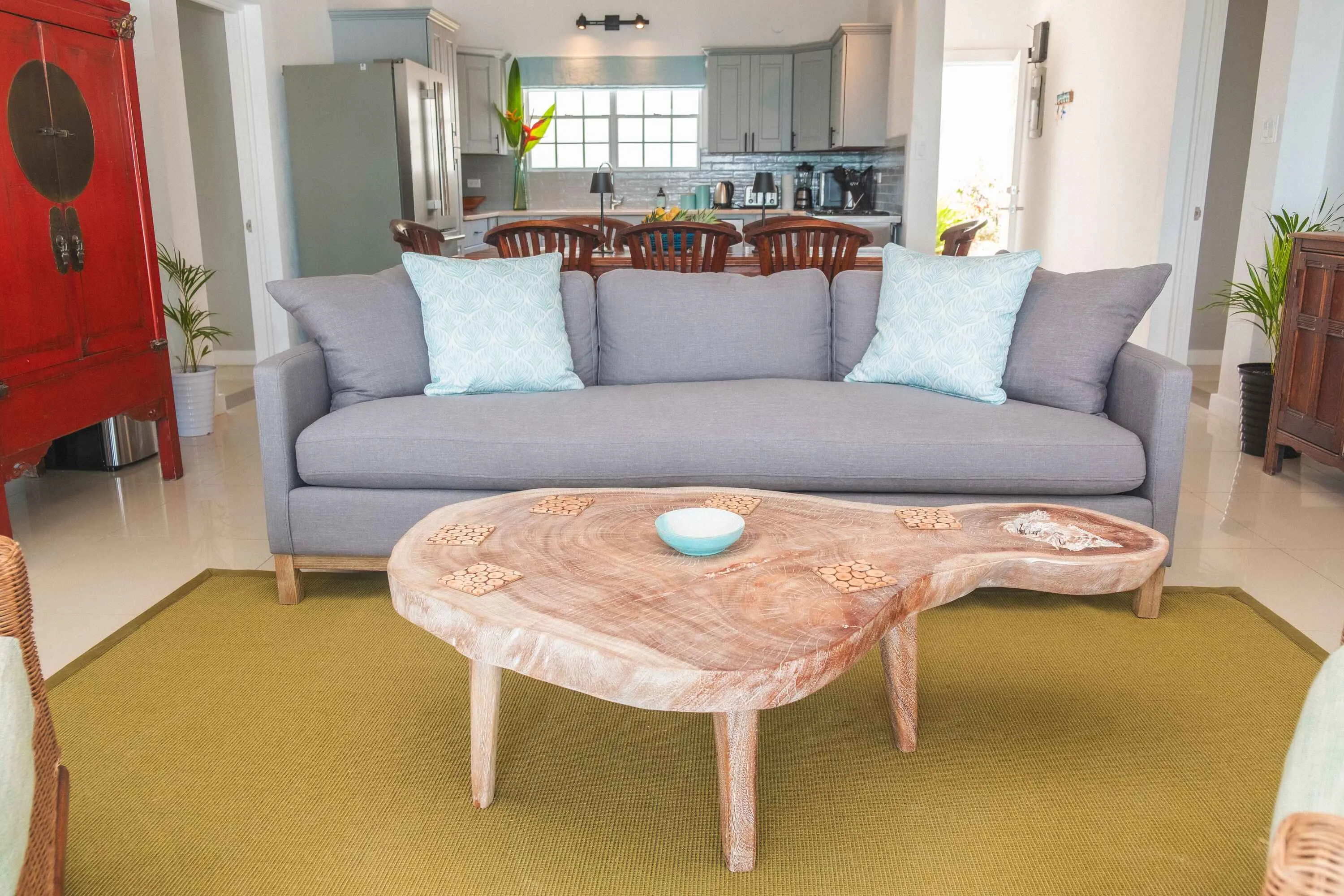 Dining area with table for eight looking out on to bay.